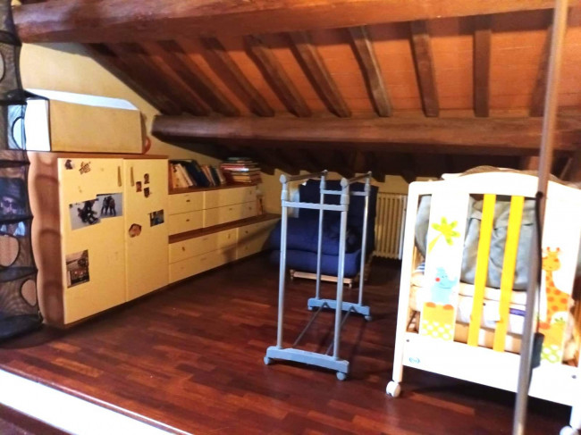 Ingrandisci la foto